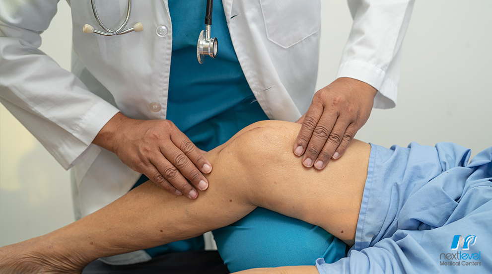 Doctor Examining Replaced Knee