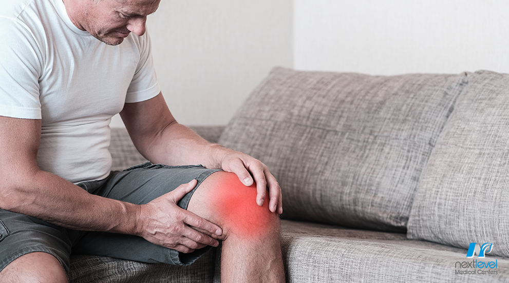 Man Holding Inflamed Knee